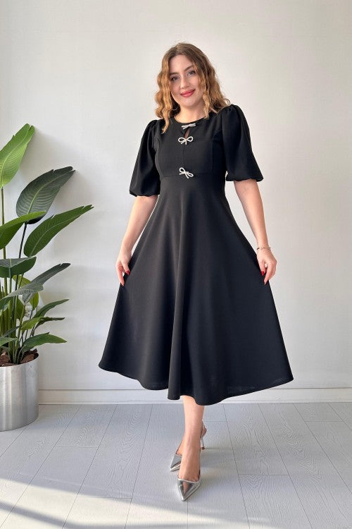 Robe en crêpe noire à trois nœuds